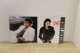 A Michael Jackson lot of two albums - Bad and Thriller - some light sleeve as per photos - vinyl