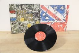 A Stone Roses debut album in VG+/EX with the rare early embossed sleeve - Silvertone UK original