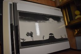 A portfolio of assorted black and white photographs, some mounted.