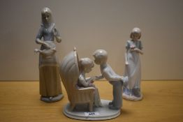 A group of three Lladro style porcelain figurines, one bearing mark for Miguel Requena (flake chip)