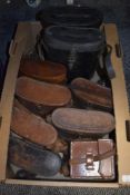 A carton of assorted sized empty leather binocular cases.