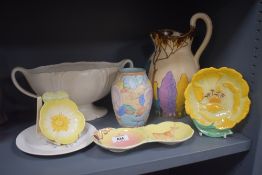 An Art Deco Beswick Ware jug, hand decorated in a Clarice Cliff style pattern and measuring 28cm