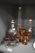 A decorative Continental tinted and silver overlay/lustre glass liqueur decanter and four glasses,