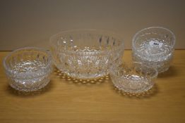 A cut glass dessert bowl with six smaller matching desert bowls.
