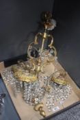 An early 20th Century Continental gilt metal ceiling light fitting, having three branches of faceted