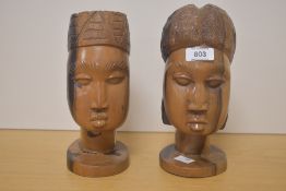 Two 20th Century African carved hardwood busts, each measuring 20cm high