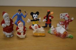 A selection of vintage confectionary/cake decorations in bisque porcelain and moulded plastic, to