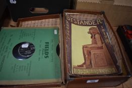 A small vintage suitcase with three copies of 'The Studio' and two issues of the 'Bystander