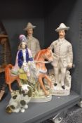 Two late Victorian Staffordshire Pottery Baden Powell figues, modelled standing aside a cannon,