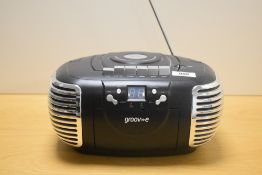 A vintage Groove portable stereo radio cassette recorder.