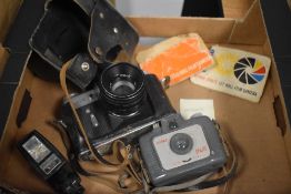 A vintage Zenit-E Moshva-80 camera, an Ilford Sprite camera and a Popular V-3 flash.