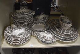A selection of Losol Ware transfer printed tableware including ashettes, dinner plates, and lidded