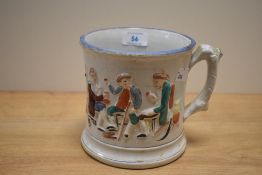 A 19th Century Staffordshire surprise frog mug, decorated in relief with drunkards and measuring