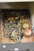 A mixed selection of copper and brass ware comprising horse brasses, a pair of decorative storage