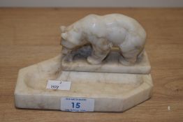 An Art Deco alabaster pen stand, the surmount modelled as a bear and measuring 15cm long