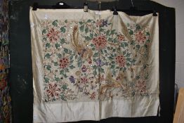 A vintage Crewel work embroidered panel, featuring birds within a stylised foliate design, measuring