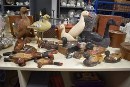 A 20th Century painted wood candle box in the form of a duck, measuring 34cm long, together with a