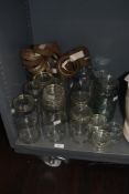 A selection of early 20th Century lidded Kilner jars, including one with embossed lettering and