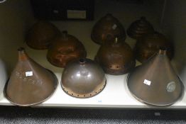A collection of nine copper Posser heads, including two conical examples marked 'Beatall' and '