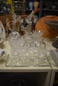 A selection of cut glass ware comprising decanters, vases and short stemmed wine glasses etc.