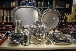A selection of silver plated ware comprising serving trays, coffee set and a small liquor measure