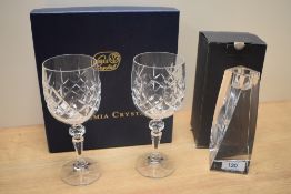 A Swedish Orrefors glass candle holder in the Tornado design, measuring 16cm high, together with a