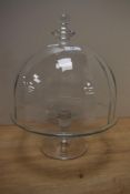 A Krosno glass cake dome and stand, measuring 35cm high, in good order