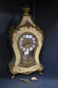 A reproduction French style mantel clock by Franz Hermle, the shaped case decorated with a printed