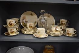 An Edwardian cut glass decanter spirit label, measuring 24cm high, together with a selection of