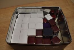 An assortment of empty ring boxes of various design