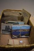 A selection of loose postcards of varied landscapes sold together with cigarette card albums