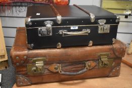 An early 20th Century brown stitched leather suitcase or travel case, measuring 40cm x 60cm x