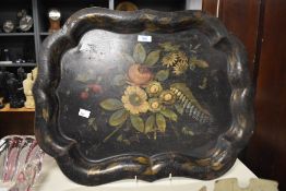 A Victorian Tole Ware tray with painted floral design to centre, 57cm wide. Sold together with a