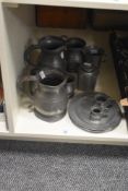 A selection of pewter ware comprising tankards of mixed sizes, plates and a James Dixon & Sons