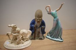 An Eichwald glazed pottery figural desk stand, modelled as a young boy with horse and measuring 18cm