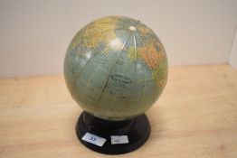 A terrestrial library lamp globe by Georama Limited, raised on a stepped plastic base and wired
