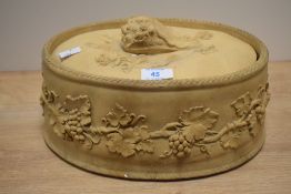 A 19th Century Wedgwood buff stoneware pie dish and cover, decorated in relief with fruiting