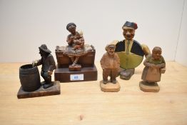 An early 20th Century novelty bottle opener and holder, modelled as a rotund man wearing a fez and