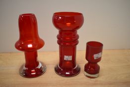 A Riihimaen Lasi Puisto glass vase, measuring 20cm high, together with two other Finnish ruby