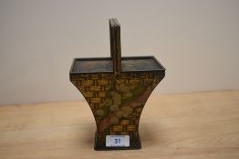 An early 20th Century Huntley & Palmers biscuit tin in the form of a fruit basket, with lithographed