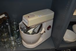 A Kenwood Chef and Major A907 mixer with attachments