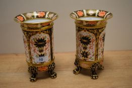 A pair of Royal Crown Derby footed vases, decorated in the Old Imari pattern with flared rims and
