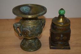 A Chinese brass and enamelled lidded pot, inset with coloured stones and decorated with embossed