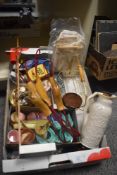 A box of assorted vintage accessories including a coloured plastic doll's tea set, playing cards,