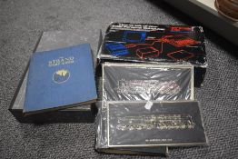 Two first day cover stamp albums sold alongside a folder of mixed loose stamps etc.