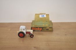 A Dinky die-cast, 305 David Brown Tractor, white body and cab, red engine and hubs, on original