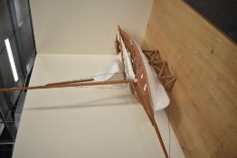 A wooden painted hull model Sail Boat, height 90cm, length 90cm, with wooden stand