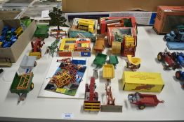 A collection of Britains and Dinky die-cast and plastic Farm Machinery and Accessories including