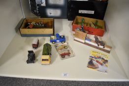 A shelf of mixed Toys including Hornby 0 gauge tin plate Platforms, Signals, Level Crossing, Dinky