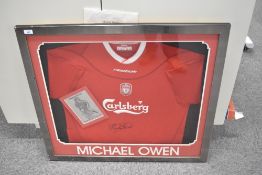 A Liverpool FC Carlsberg Football Shirt bearing signature from Michael Owen, framed, glazed and